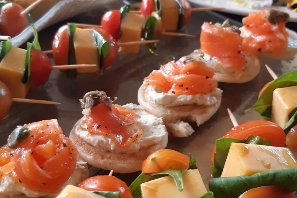 Smoked salmon and cheese, showcasing a colorful and appetizing appetizer.